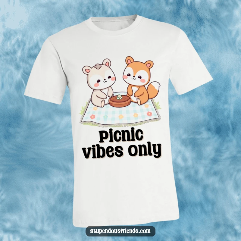 Funny t-shirt graphic of two smiling animal characters sharing a picnic spread on a blanket, enjoying each other's company.